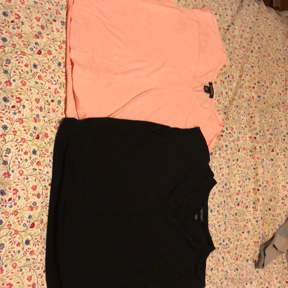 Two v neck t shirts.